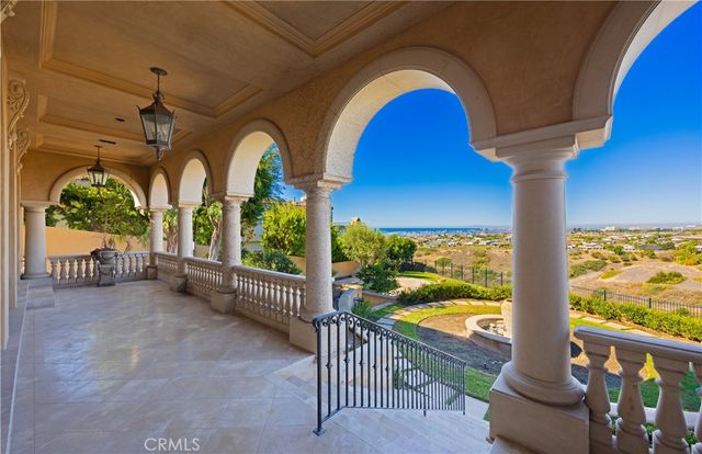 a view of swimming pool from a balcony