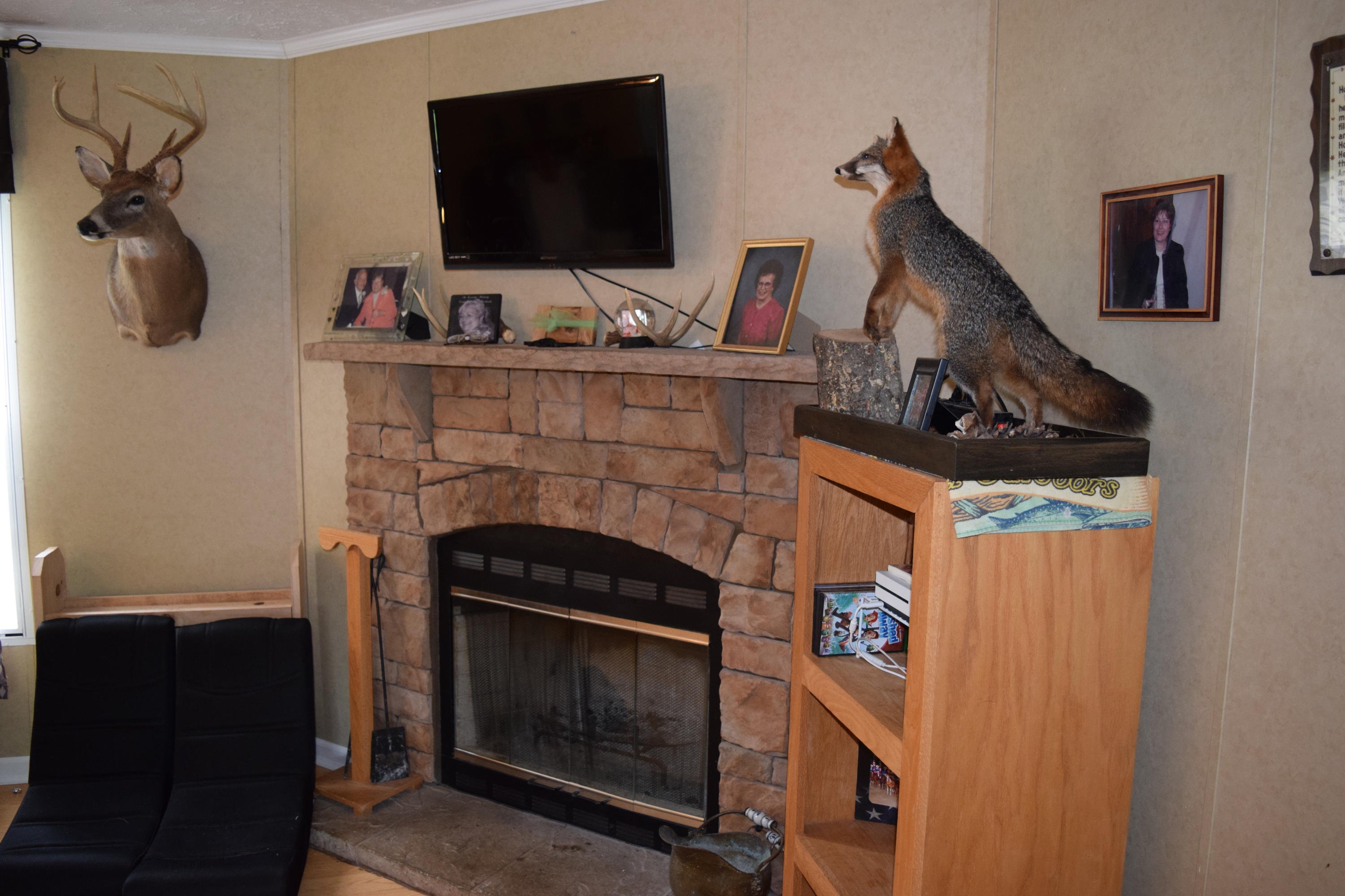 4752 Waidsboro Road Ferrum, VA 24088 - Photo 21 of 38 a living room with furniture and a fireplace