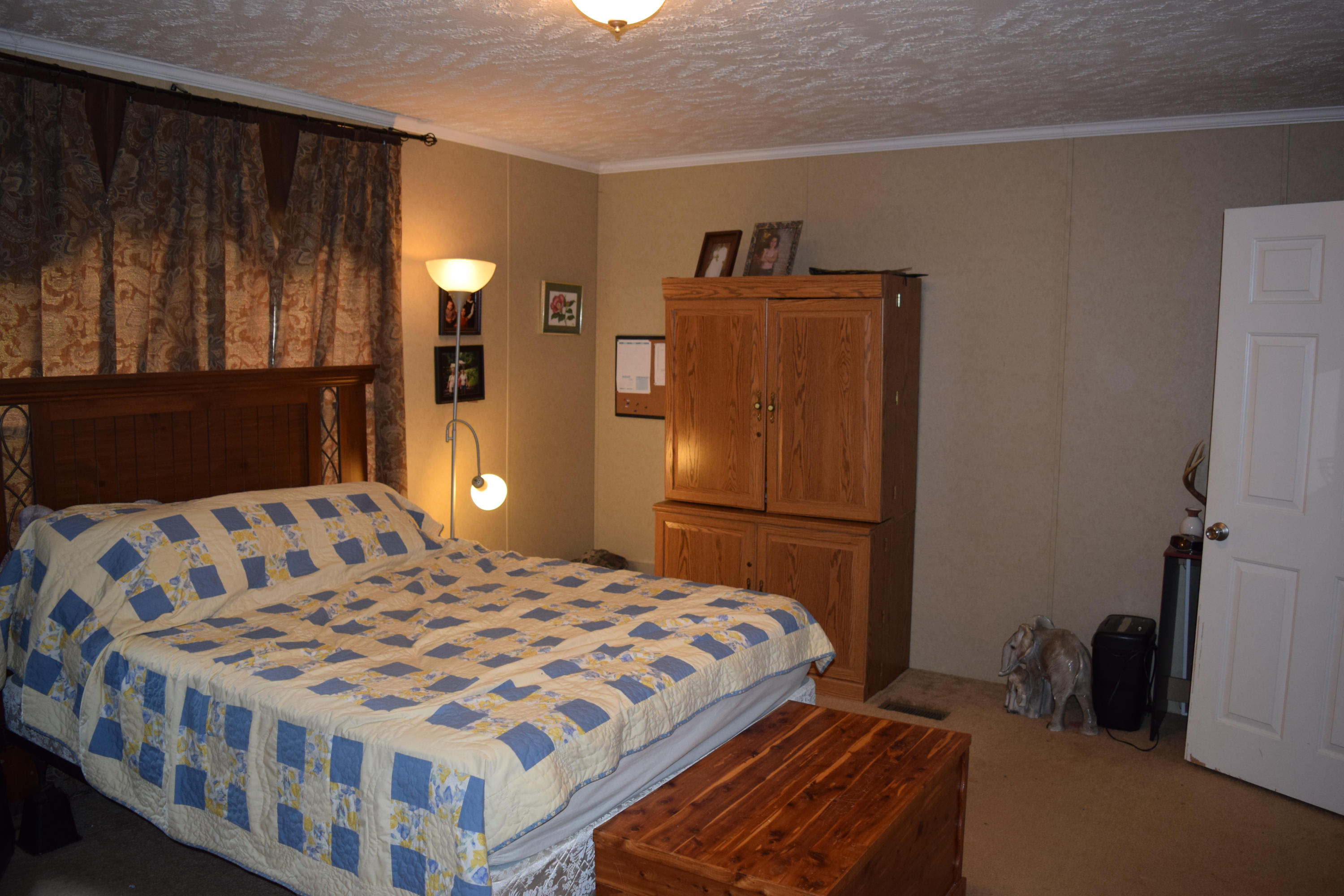 4752 Waidsboro Road Ferrum, VA 24088 - Photo 22 of 38 a bedroom with a bed and wooden floor