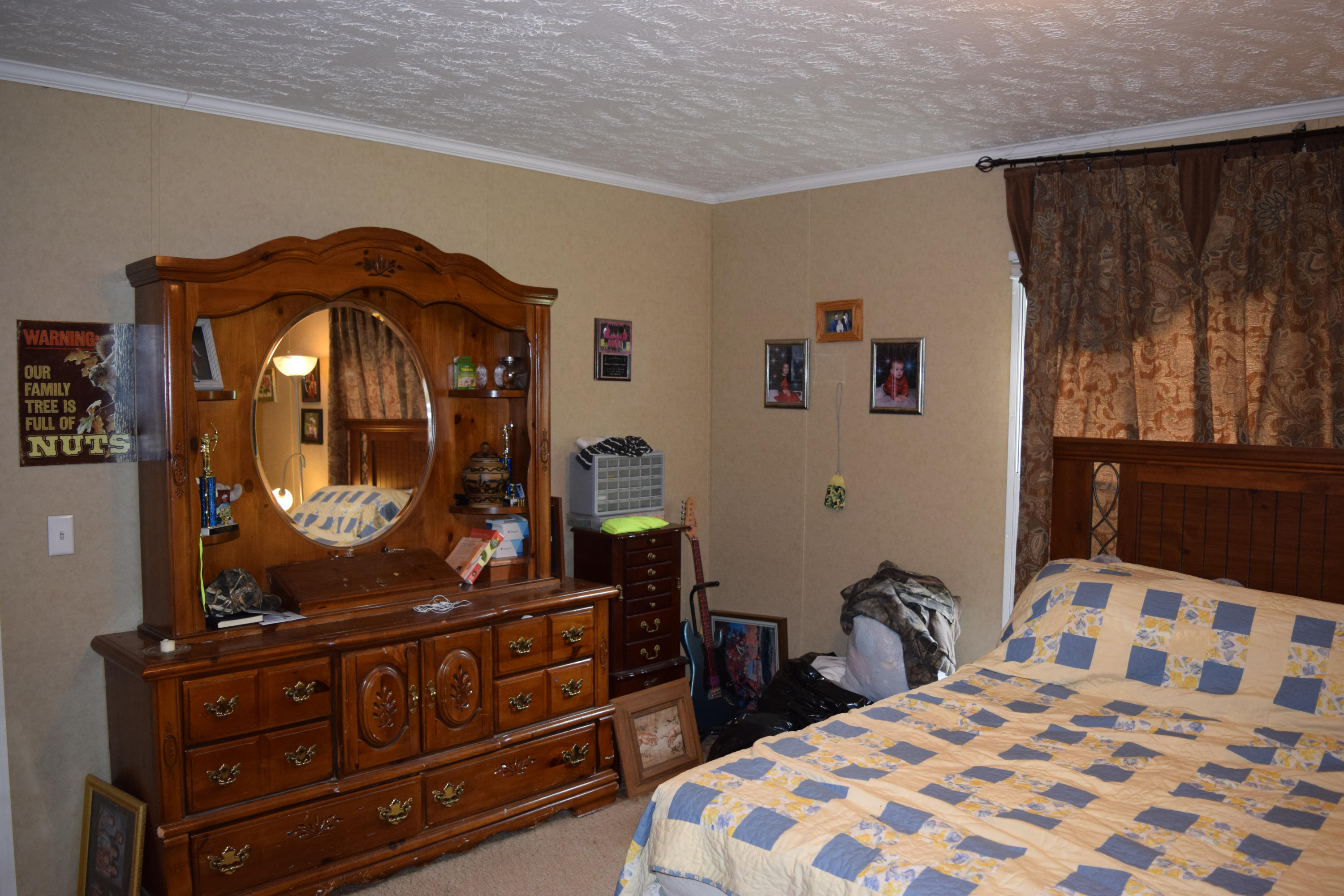 4752 Waidsboro Road Ferrum, VA 24088 - Photo 23 of 38 a bedroom with a bed and a dresser with mirror