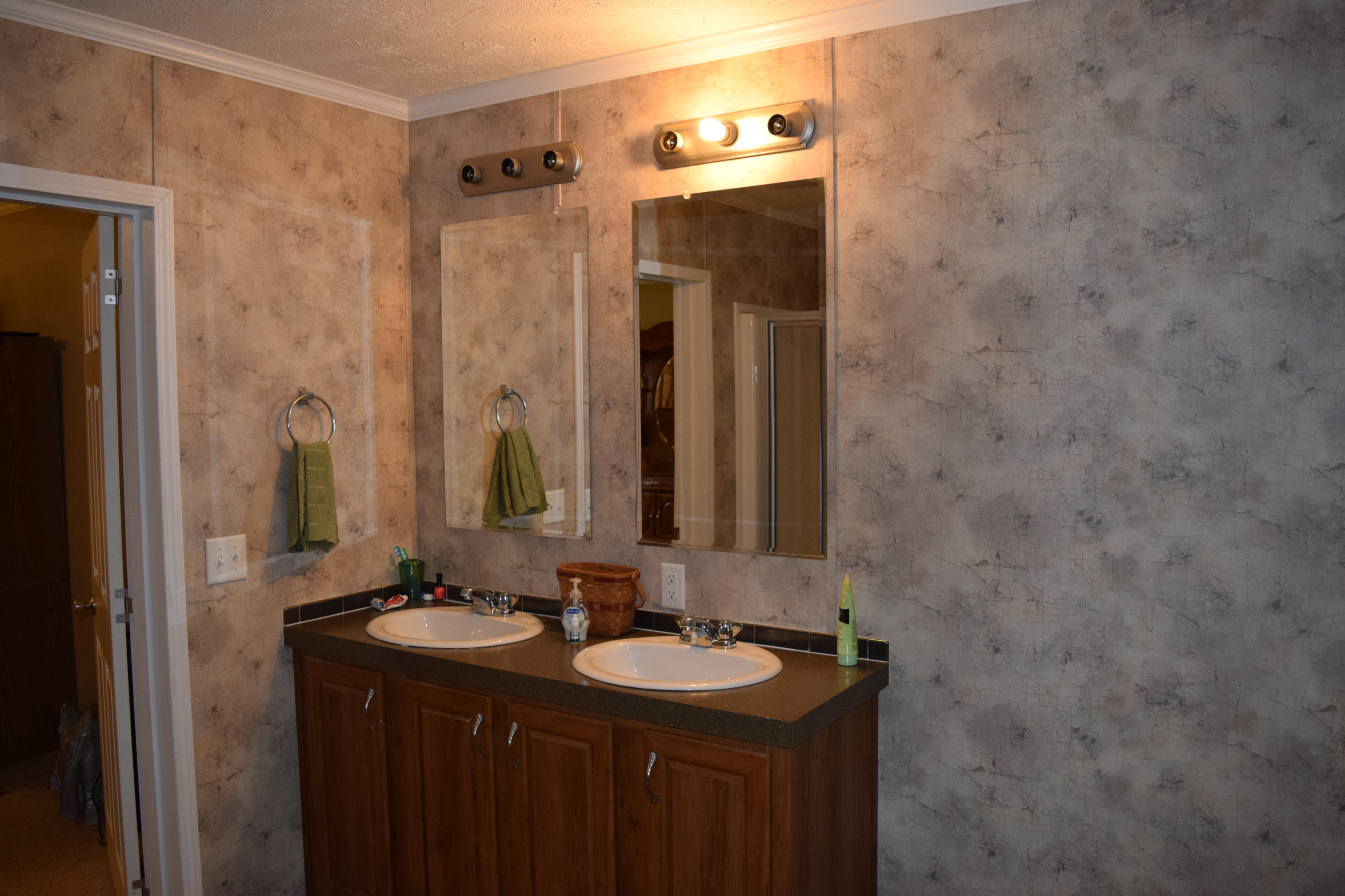 4752 Waidsboro Road Ferrum, VA 24088 - Photo 24 of 38 a bathroom with a sink and a mirror