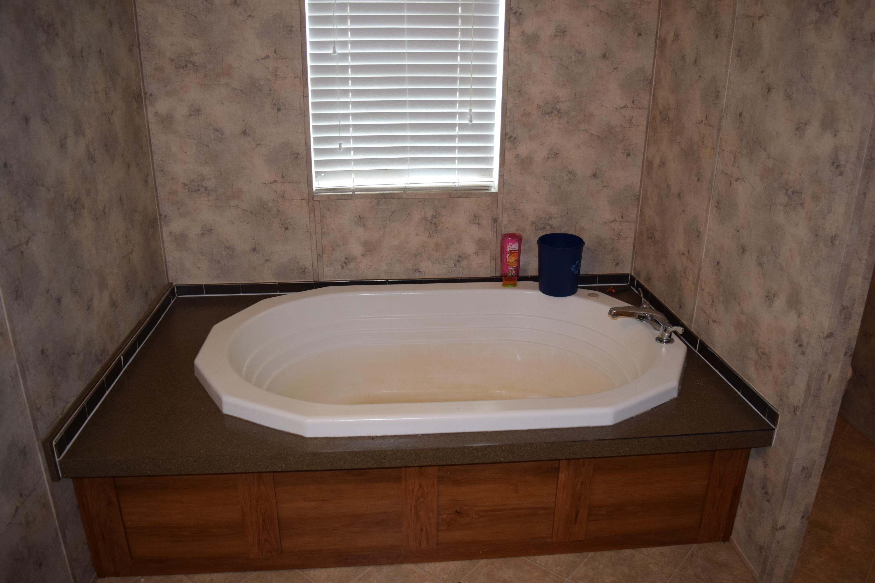 4752 Waidsboro Road Ferrum, VA 24088 - Photo 25 of 38 a white bath tub sitting in a bathroom