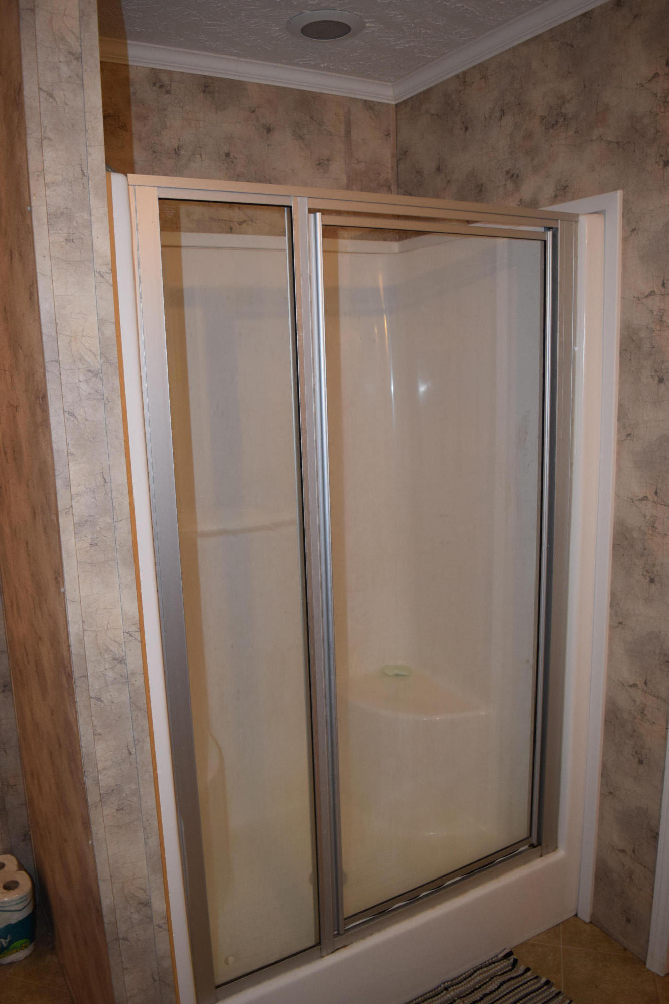 4752 Waidsboro Road Ferrum, VA 24088 - Photo 26 of 38 a bathroom with a glass shower door and sink