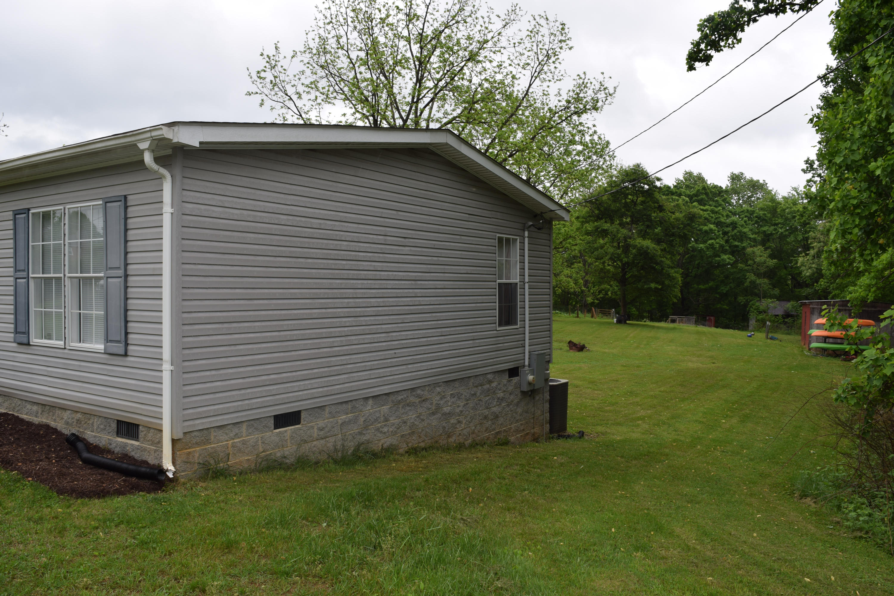 4752 Waidsboro Road Ferrum, VA 24088 - Photo 4 of 38 a view of backyard with barbeque grill and a large tree
