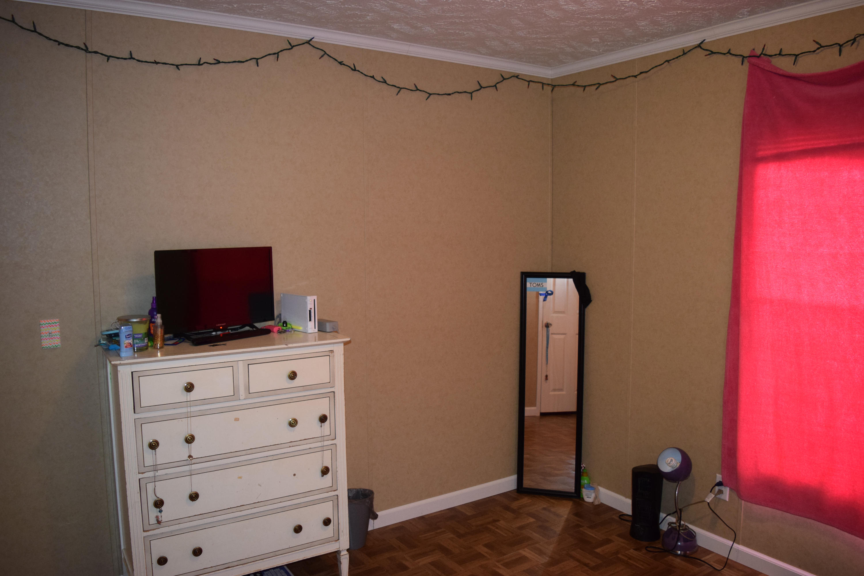 4752 Waidsboro Road Ferrum, VA 24088 - Photo 34 of 38 a living room with furniture and a flat screen tv