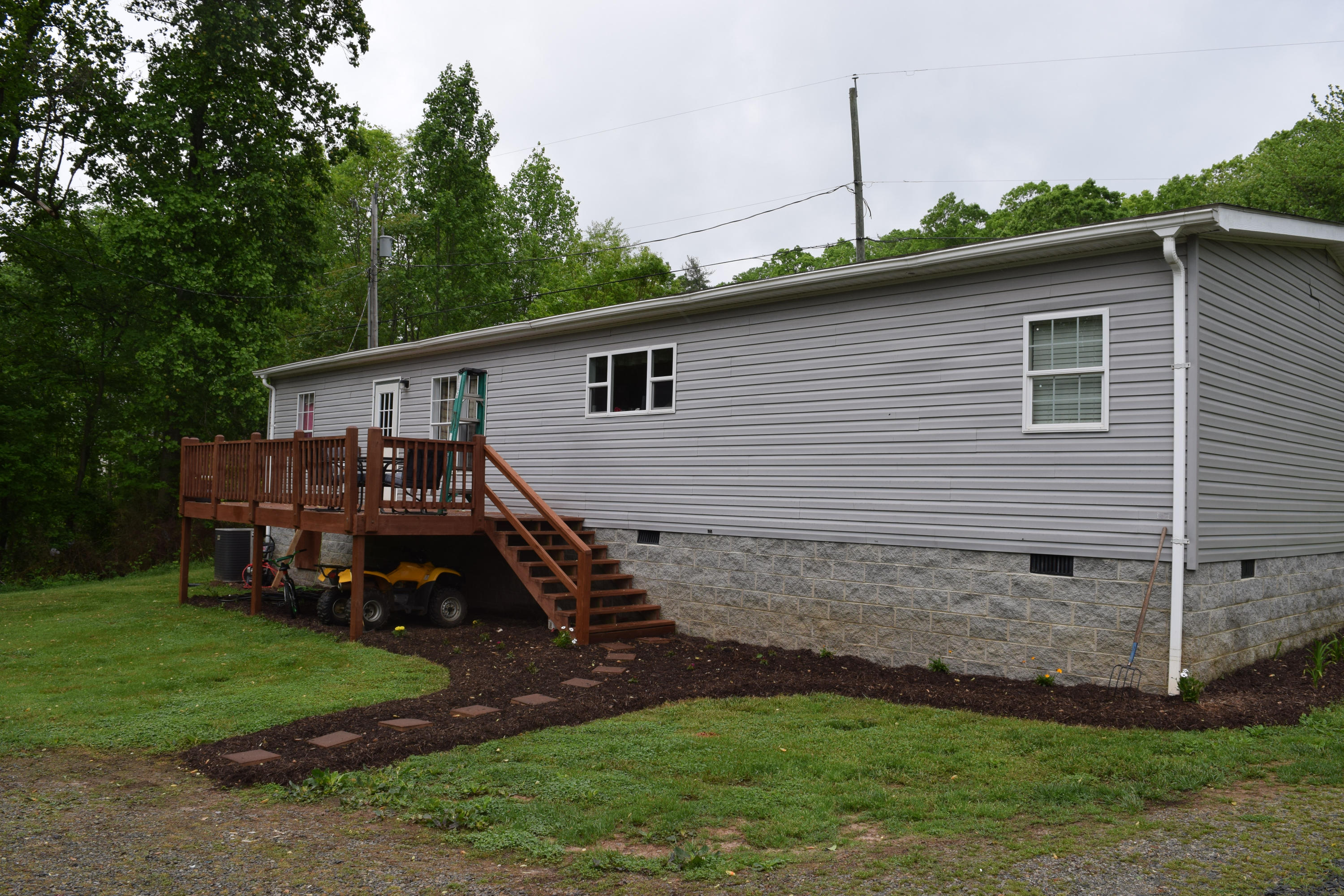 4752 Waidsboro Road Ferrum, VA 24088 - Photo 6 of 38 a backyard of a house with wooden fence