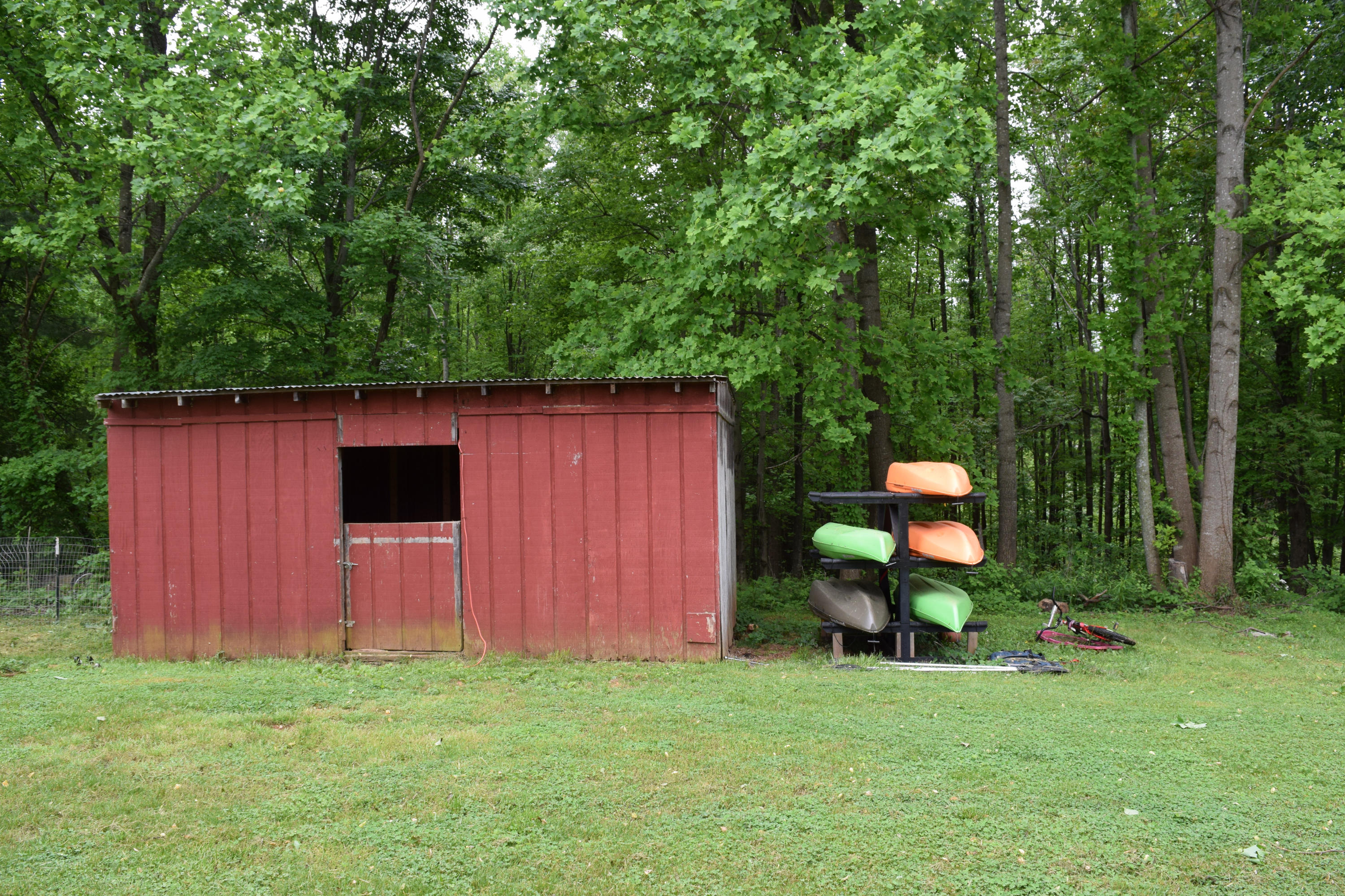 4752 Waidsboro Road Ferrum, VA 24088 - Photo 7 of 38 a view of a backyard with table and chairs and wooden fence