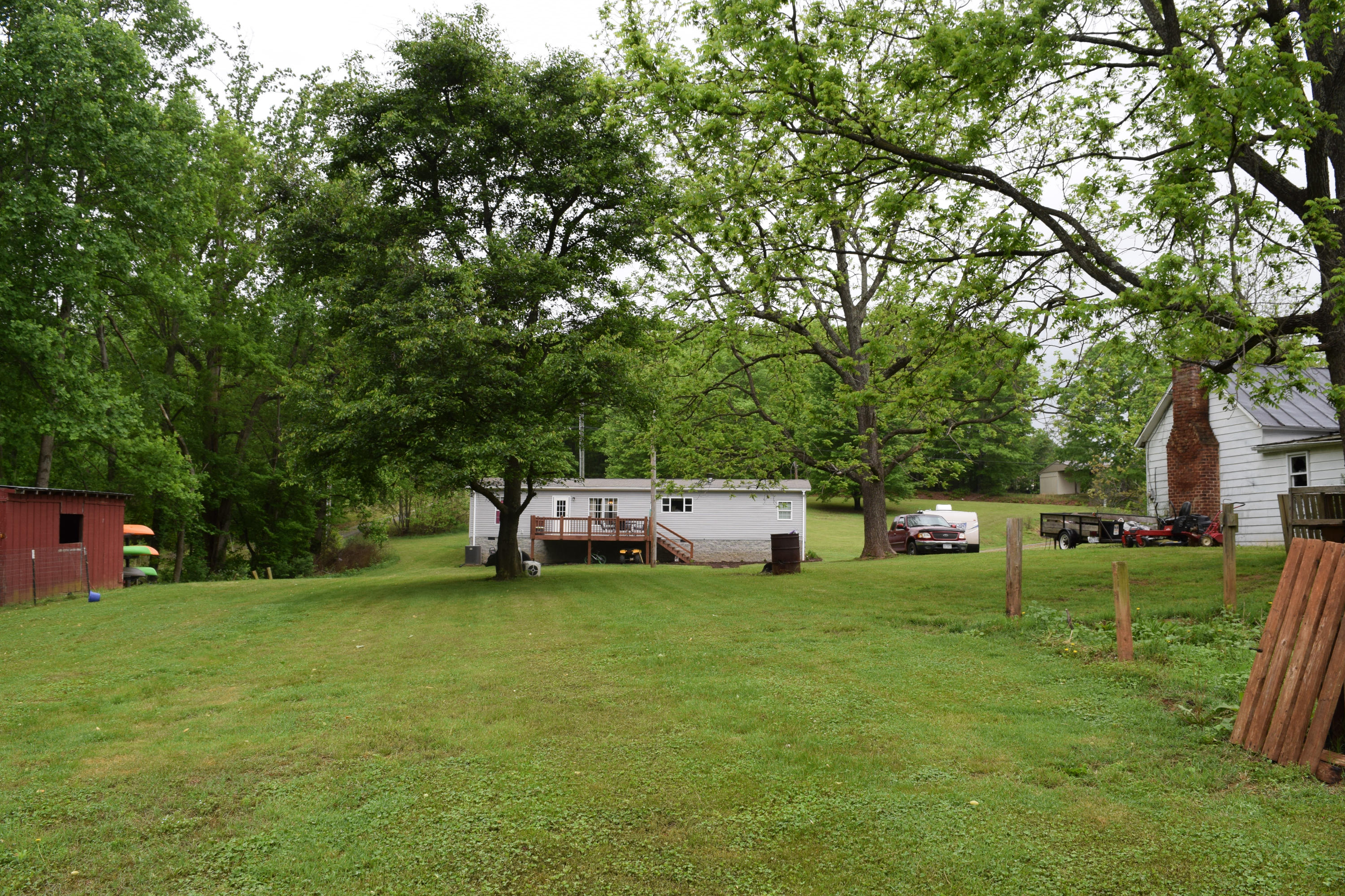 4752 Waidsboro Road Ferrum, VA 24088 - Photo 10 of 38 a view of a house with a big yard and sitting area