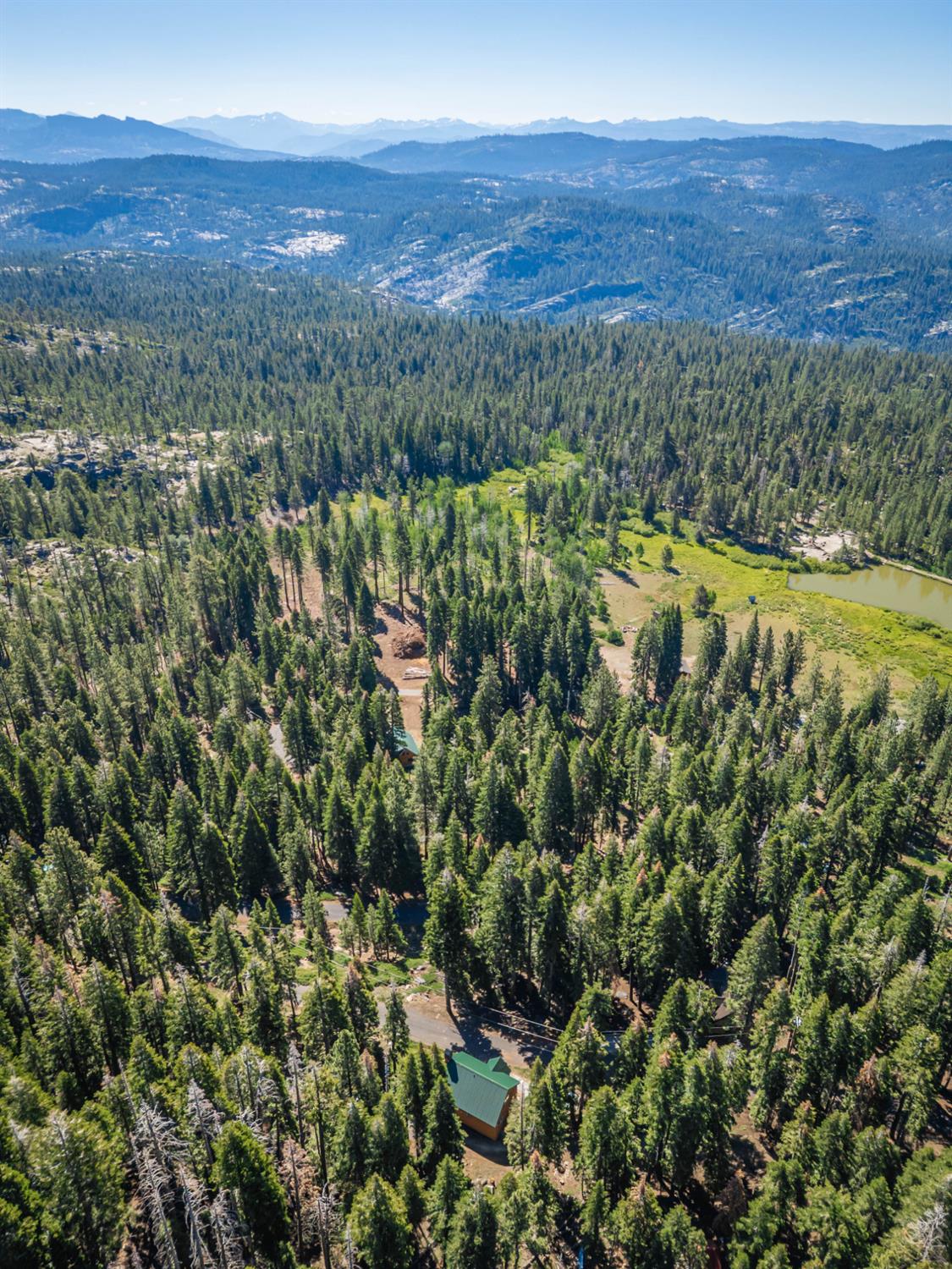 1070 Mountain View Road Arnold, CA 95223 - Photo 24 of 99 a view of a lush green field with an ocean