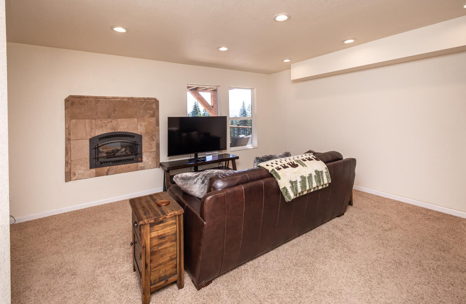 1070 Mountain View Road Arnold, CA 95223 - Photo 87 of 99 a living room with furniture a flat screen tv and a fireplace
