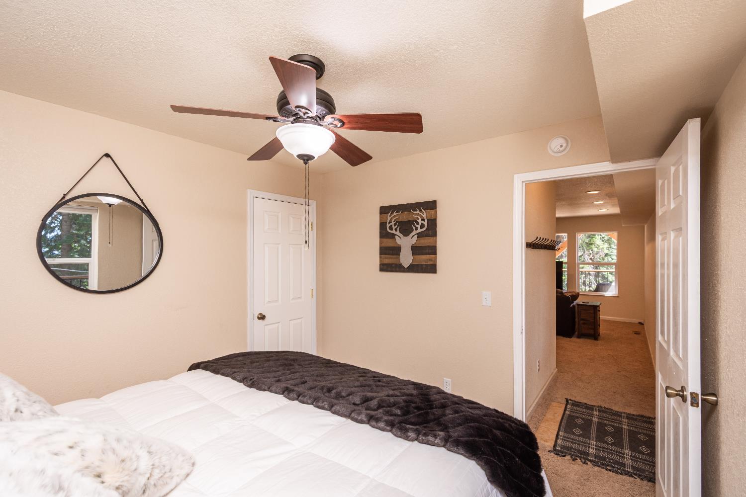 1070 Mountain View Road Arnold, CA 95223 - Photo 93 of 99 a bedroom with a bed and a mirror