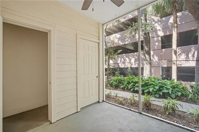 a view of a glass door with a yard