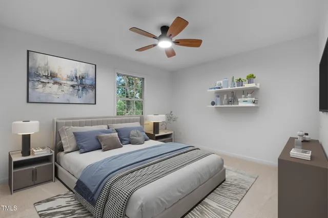 a bedroom with a large bed and a chandelier