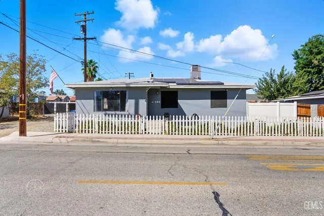 a front view of a house with a fence
