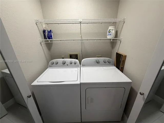 a utility room with dryer and washer