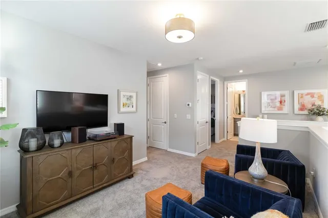 a bathroom with a sink and mirror with bathtub