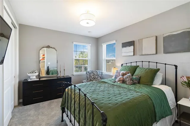 a bathroom with a granite countertop sink mirror vanity and toilet