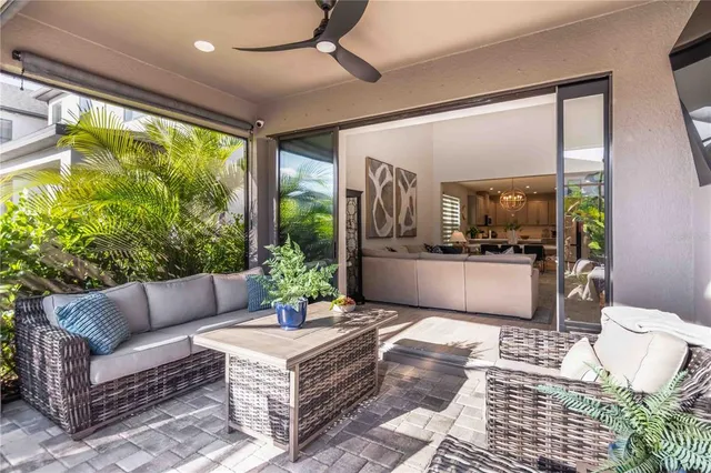 an aerial view of residential houses with outdoor space and trees