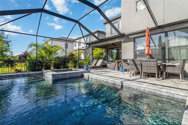 an aerial view of residential houses with outdoor space and street view
