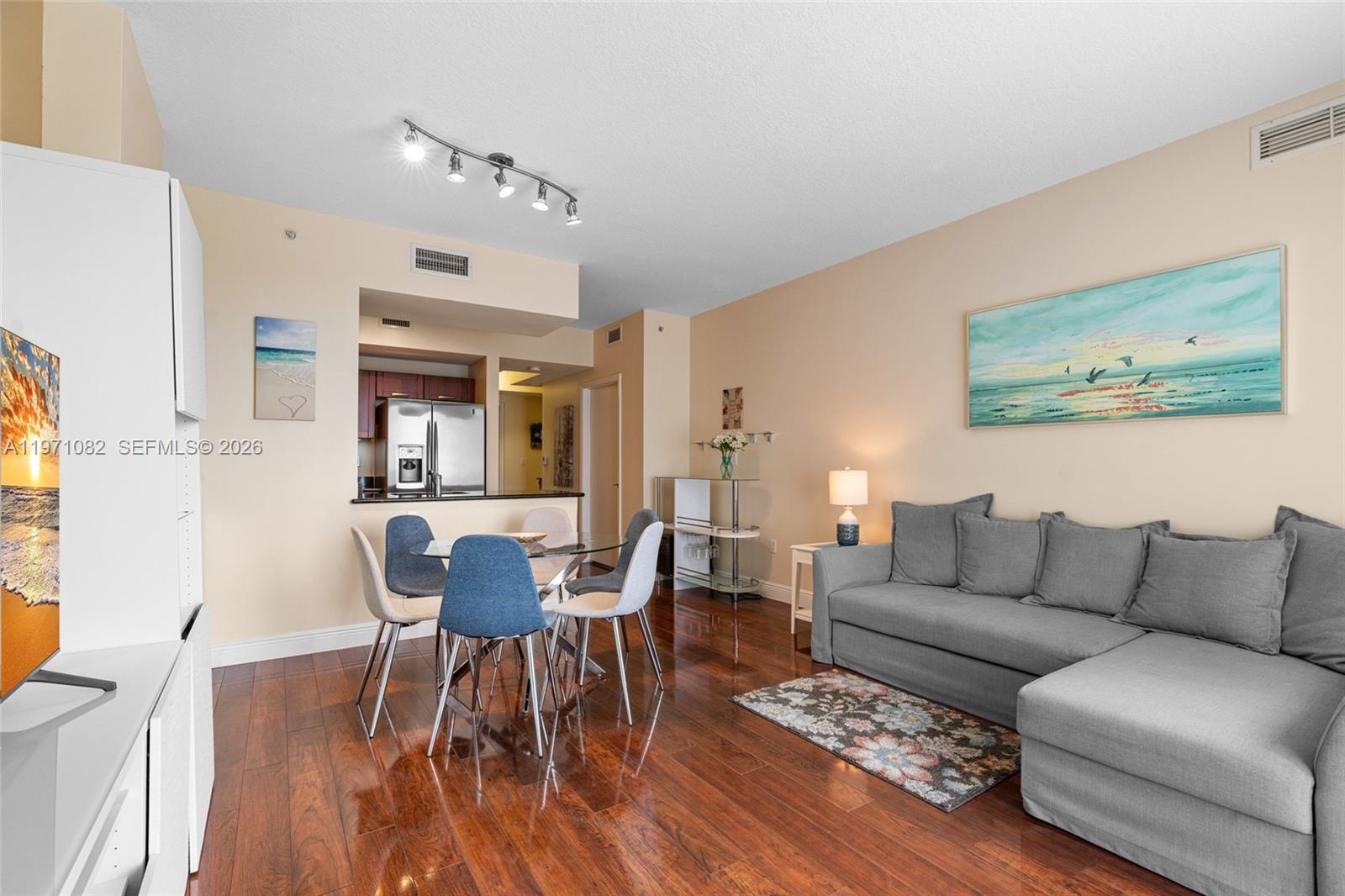 7275 Southwest 90th Way, Unit 404 Miami, FL 33156 - Photo 10 of 35 a living room with furniture and a wooden floor