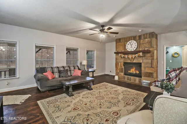 a living room with furniture and a flat screen tv