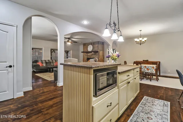 a kitchen with lots of counter top space and appliances