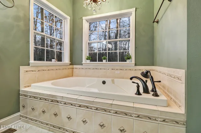 a view of walk in closet with clothes