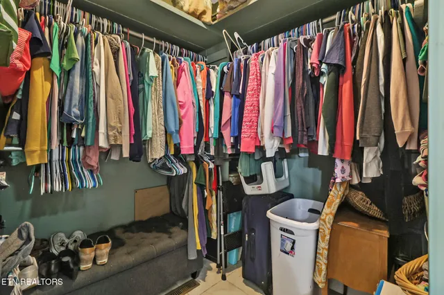 a view of a room with wooden floor and a window