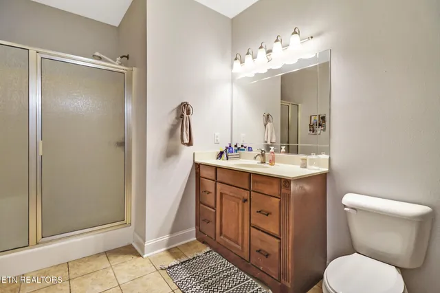 a kitchen with granite countertop a sink cabinets and appliances