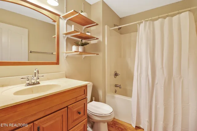 a bedroom with a large bed and a large window