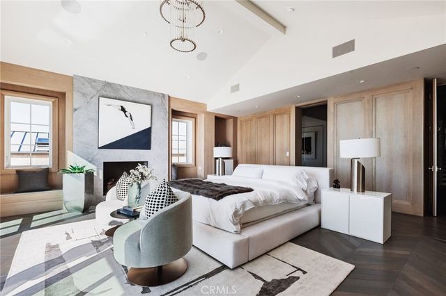 a living room with furniture a rug and white walls