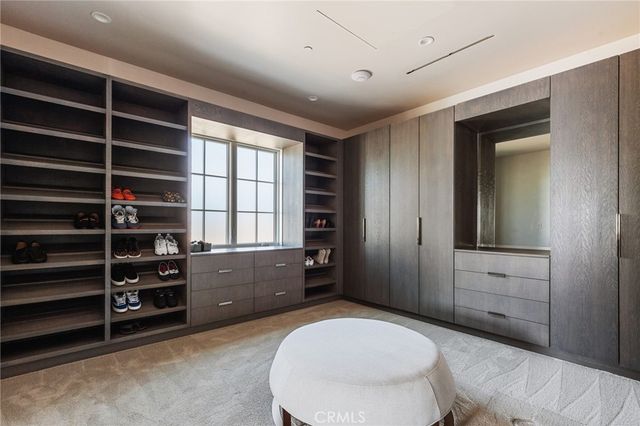 a living room with closet and furniture