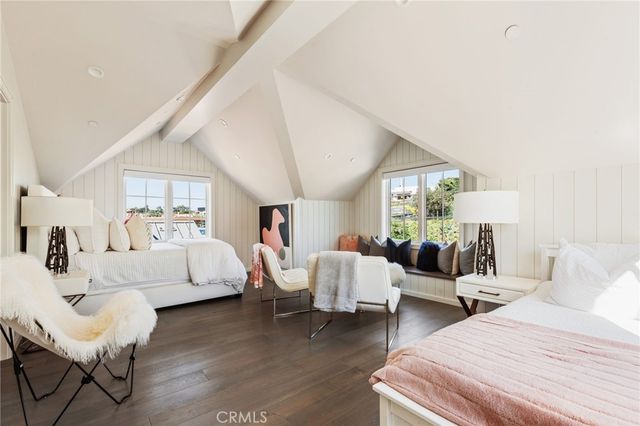 a bed room with furniture and a large window