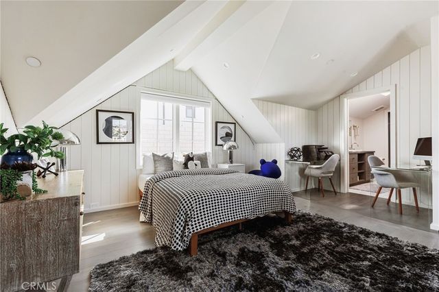 a bedroom with furniture and a bathtub
