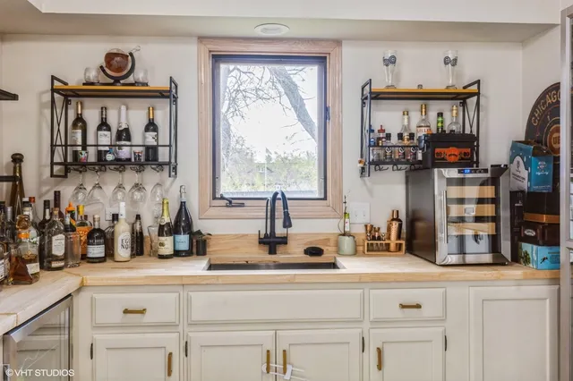 a kitchen with sink and a window