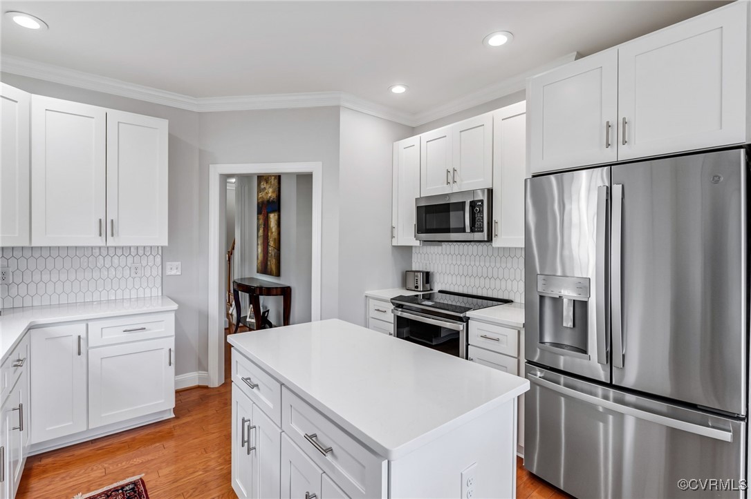 5060 Park Commons Loop Glen Allen, VA 23059 - Photo 12 of 38 Kitchen with light wood finished floors, stainless
