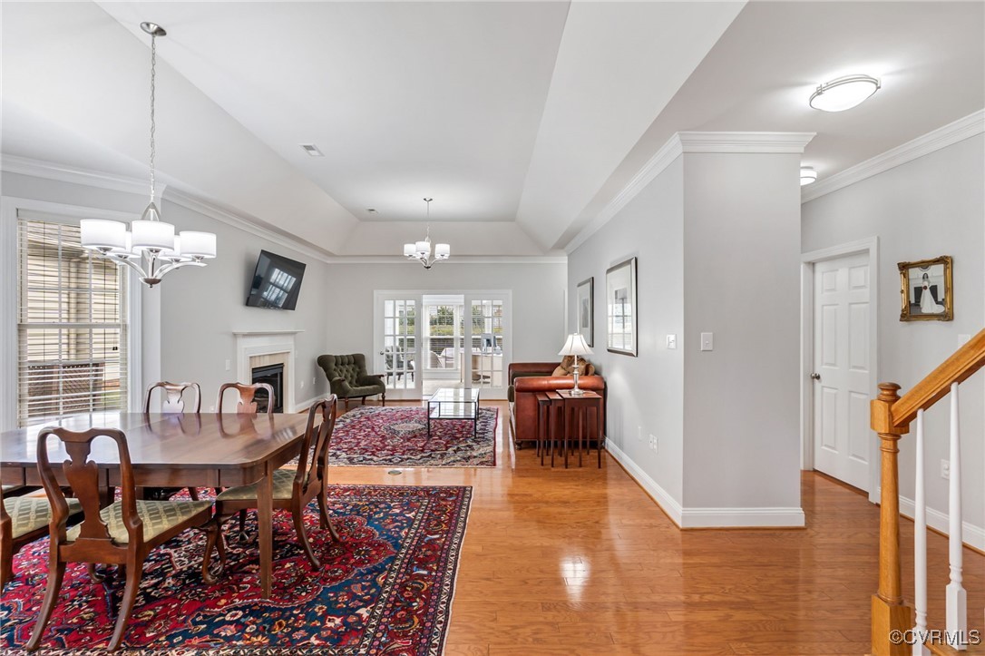 5060 Park Commons Loop Glen Allen, VA 23059 - Photo 15 of 38 a living room with furniture a dining table and a chandelier