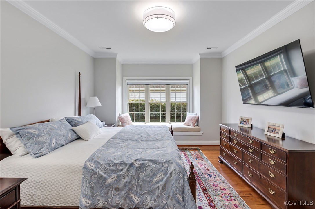 5060 Park Commons Loop Glen Allen, VA 23059 - Photo 21 of 38 a bedroom with a bed and wooden floor