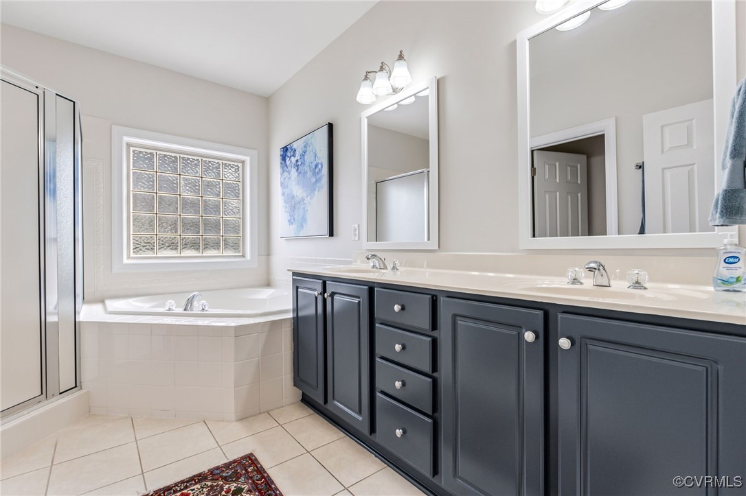 5060 Park Commons Loop Glen Allen, VA 23059 - Photo 23 of 38 Full bathroom featuring a bath, a shower stall, a