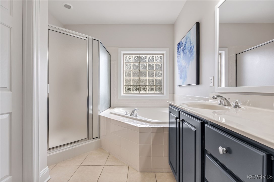 5060 Park Commons Loop Glen Allen, VA 23059 - Photo 25 of 38 a spacious bathroom with a granite countertop sink and a bathtub