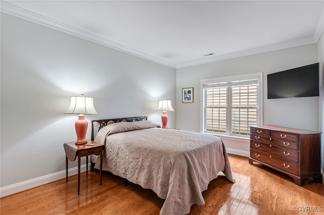 5060 Park Commons Loop Glen Allen, VA 23059 - Photo 29 of 38 a bedroom with a bed a flat screen tv and dresser