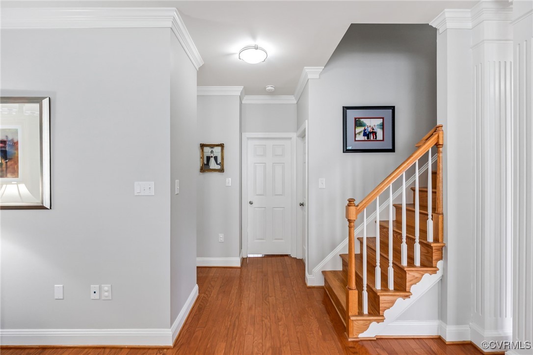 5060 Park Commons Loop Glen Allen, VA 23059 - Photo 30 of 38 a view of a hallway with wooden floor and stairs
