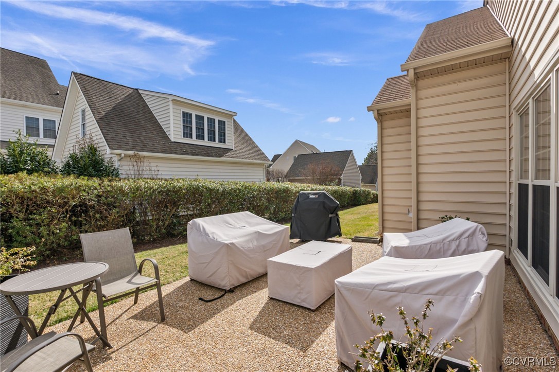 5060 Park Commons Loop Glen Allen, VA 23059 - Photo 33 of 38 a view of a patio with couches table and chairs and potted plants