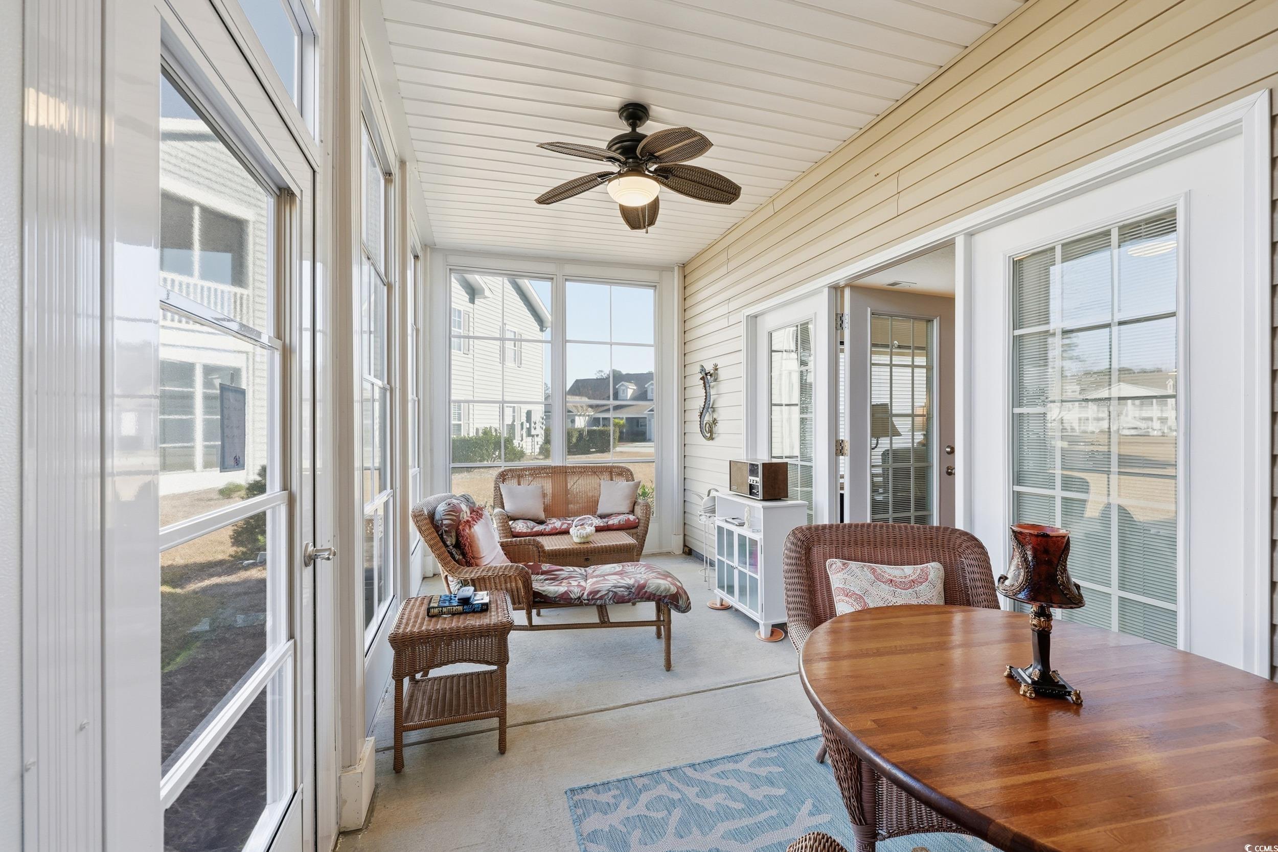 822 Sail Lane, Unit 103 Murrells Inlet, SC 29576 - Photo 26 of 37 Sunroom / solarium featuring a ceiling fan, outdoor dining space, and an outdoor living space