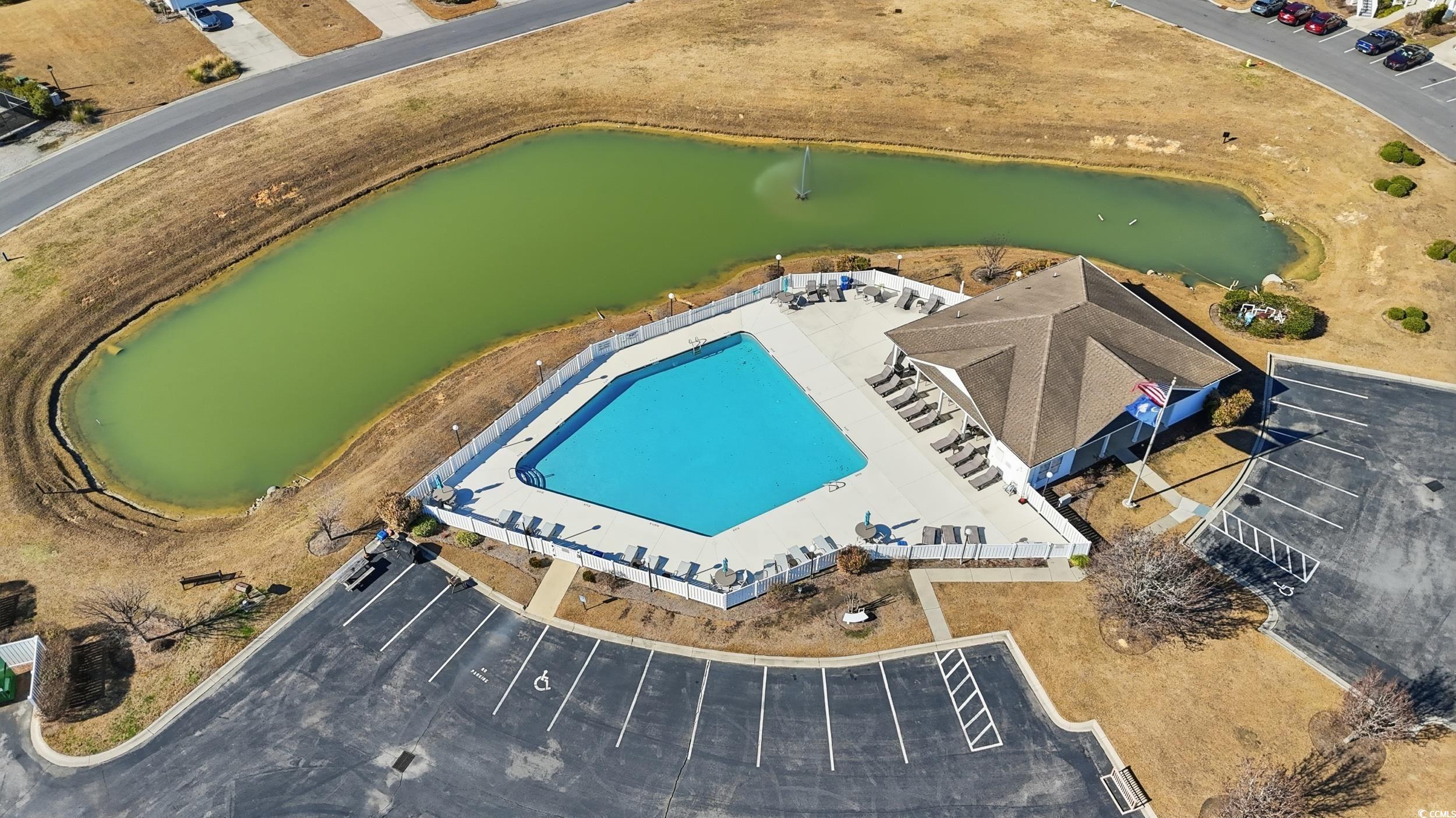 822 Sail Lane, Unit 103 Murrells Inlet, SC 29576 - Photo 36 of 37 Aerial view of a pool and a nearby body of water