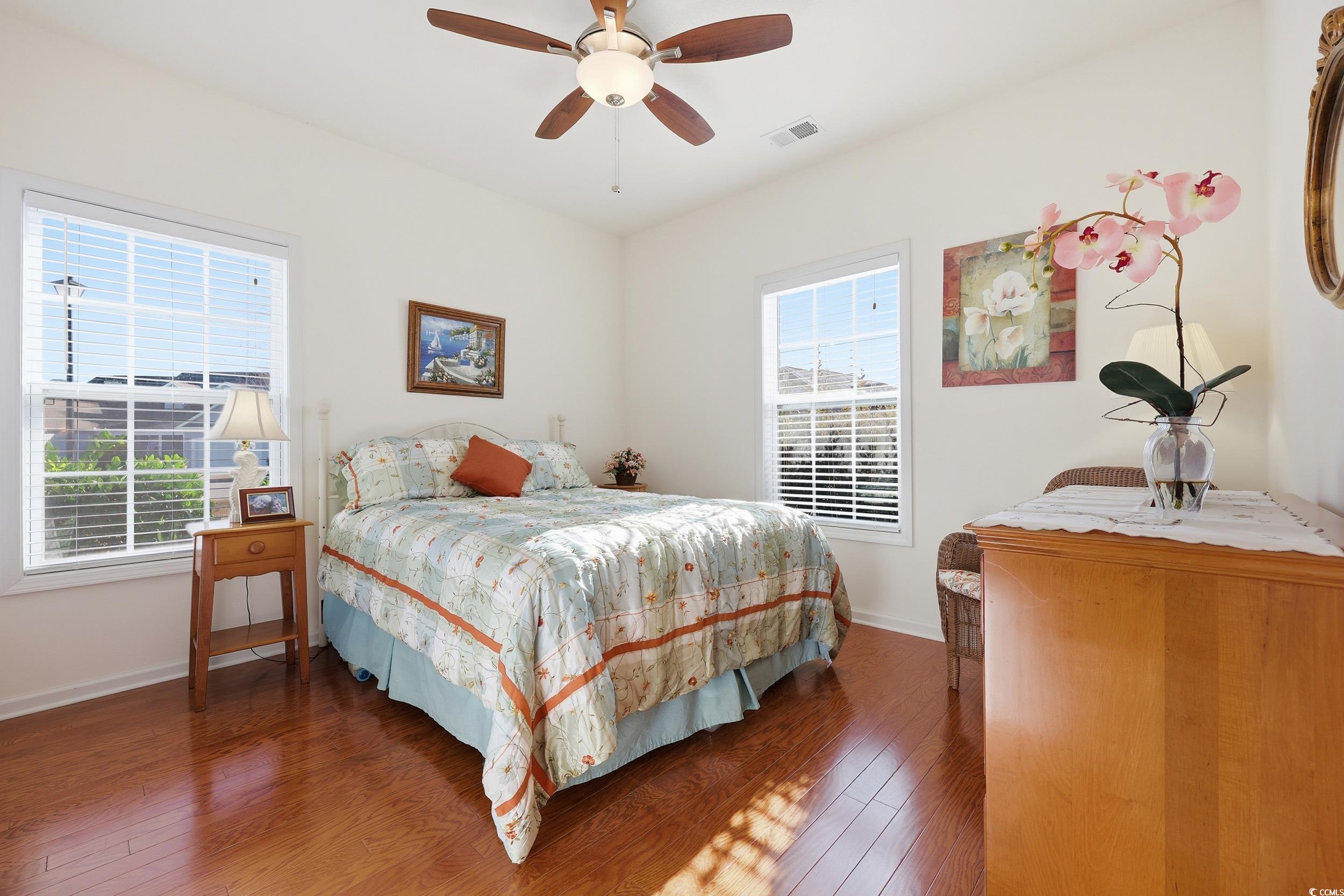 822 Sail Lane, Unit 103 Murrells Inlet, SC 29576 - Photo 8 of 37 Bedroom featuring hardwood / wood-style floors and ceiling fan