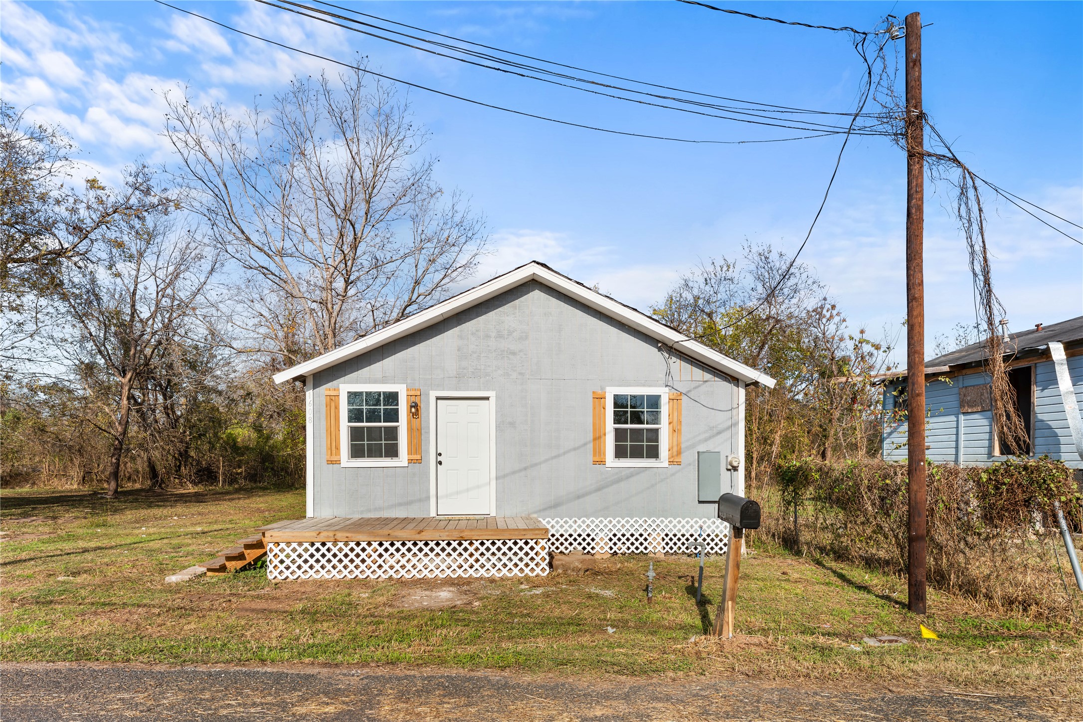 1608 Connie Street Wharton, TX 77488 - Photo 1 of 24 a view of a house with a yard and fence