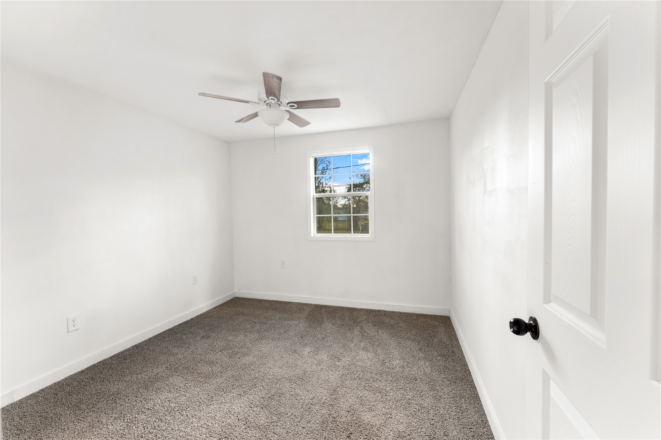 1608 Connie Street Wharton, TX 77488 - Photo 12 of 24 an empty room with a window