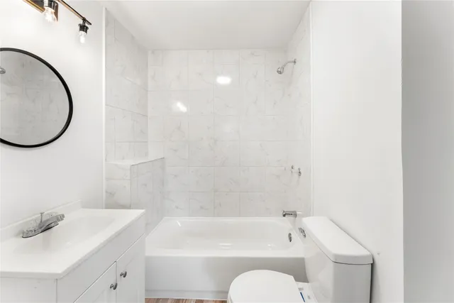 a bathroom with a sink a toilet and a bathtub