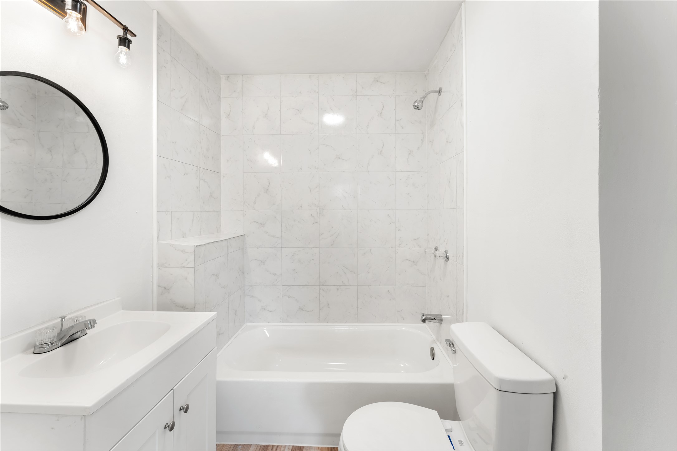 1608 Connie Street Wharton, TX 77488 - Photo 13 of 24 a bathroom with a sink a toilet and a bathtub